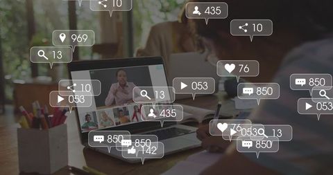 Streaming remote team meeting on laptop with floating social engagement icons