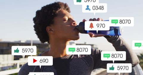 African American Athlete Drinking Water with Social Media Notifications