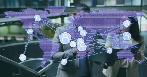Business Professionals Analyzing Interactive Global Network Map with Technology
