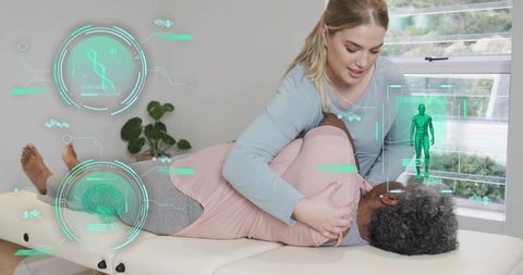 Physiotherapist performing assisted shoulder mobilization with augmented reality hud