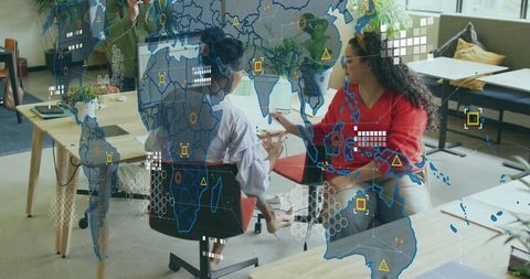 Collaborating in Modern Office with Digital World Map Overlay