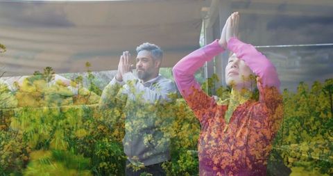 Couple Practicing Yoga Surrounded by Natural Serenity