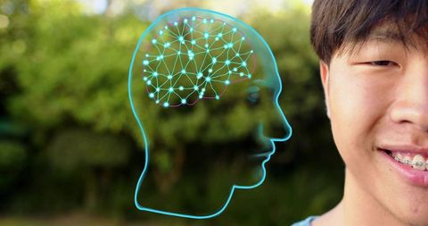 Smiling asian teen wearing braces with neon brain network overlay outdoors