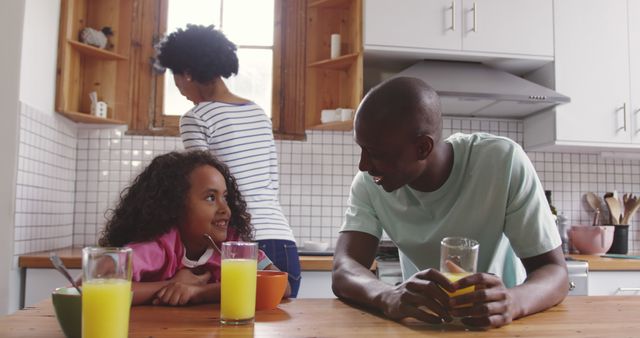 Happy African American Family Enjoying Breakfast in Modern Kitchen - Download Free Stock Images Pikwizard.com