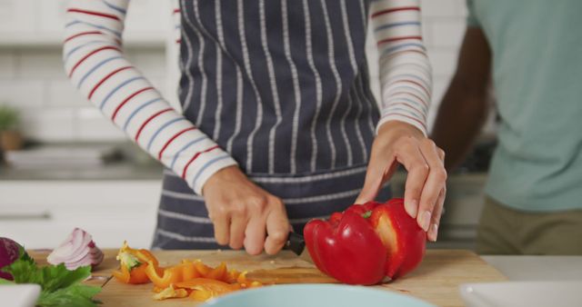 Person Chopping Red Bell Pepper for Meal Preparation - Download Free Stock Images Pikwizard.com