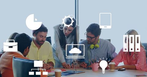 Team collaboration with digital interface icons on office meeting