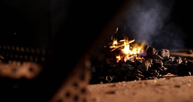 Close-Up of Smoldering Coals Amid Glowing Fire, Blurred Foreground - Download Free Stock Images Pikwizard.com