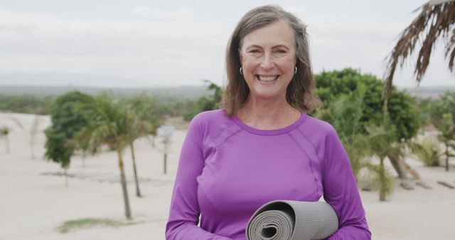 Senior Woman with Yoga Mat Smiling Outdoors - Download Free Stock Images Pikwizard.com