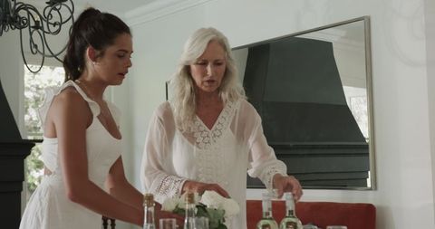 Bride and Mother Preparing for Wedding Day Celebration