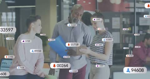 Diverse Marketing Team Analyzing Digital Metrics on Tablet