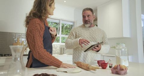 Couple Baking Together Intimately in Bright Kitchen Setting