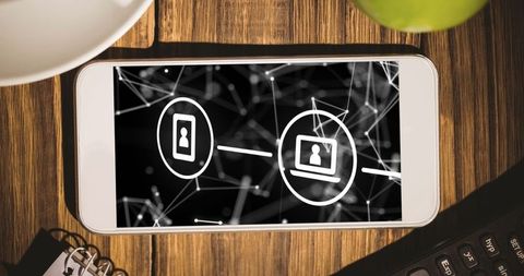 Smartphone displaying network icons visualizing digital connectivity