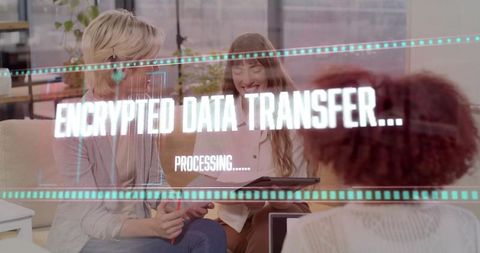Women collaborating in modern office lounge with encrypted data transfer hologram