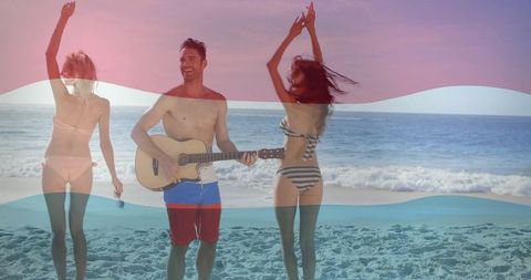 Group of Friends Singing and Dancing at Sunset Beach Party