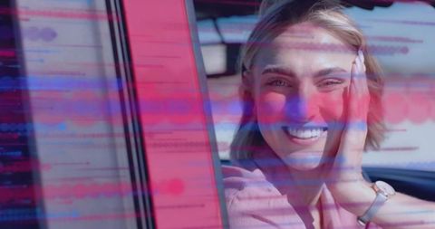Smiling Woman In Car With Digital Overlay Design