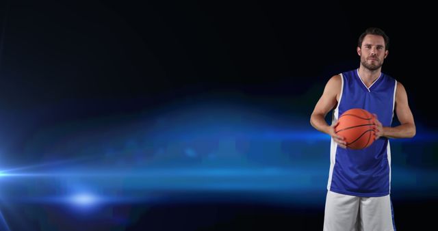 Basketball Player Holding Ball with Blue Lighting Background - Download Free Stock Images Pikwizard.com