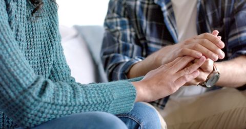 Interracial Couple Embracing Comfort and Support on Sofa - Download Free Stock Images Pikwizard.com