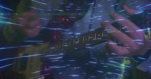 Vibrant Night Performance with Guitar and Light Effects