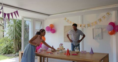 Couple Decorating Room for Joyful Birthday Celebration