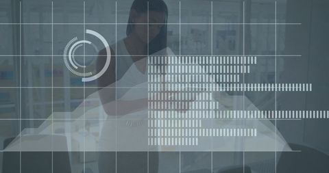 Data overlay on businesswoman with tablet in office