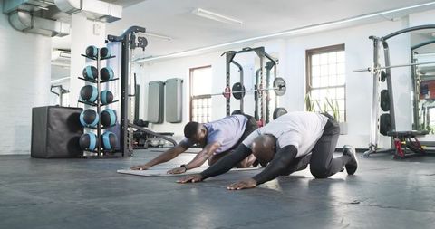 Stretching Workout Partners in Modern Gym