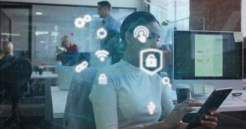 Woman tapping tablet with holographic cybersecurity interface in modern open office