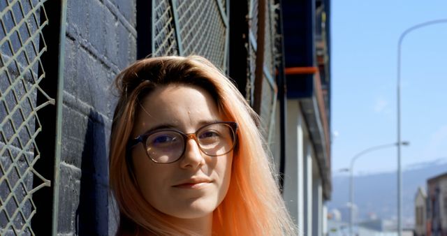 Young Woman with Glasses in Urban Street Setting - Download Free Stock Images Pikwizard.com