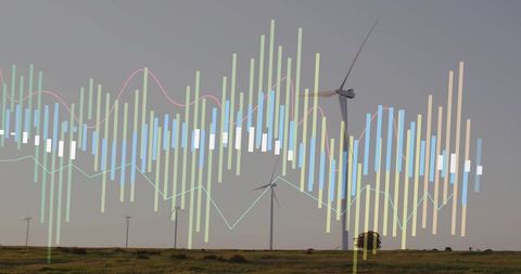Rotating wind turbines on prairie with data overlay visualizing renewable energy performance