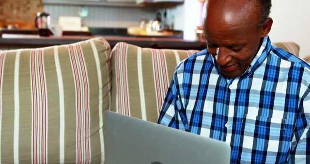 Senior African American Man Using Laptop on Couch - Download Free Stock Images Pikwizard.com