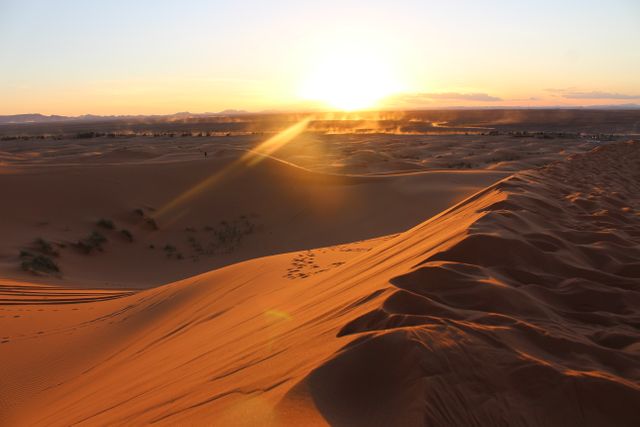 Sunrise over Sahara Desert sand dunes with dramatic light and shadows - Download Free Stock Photos Pikwizard.com