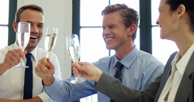 Business people toasting with champagne in a restaurant