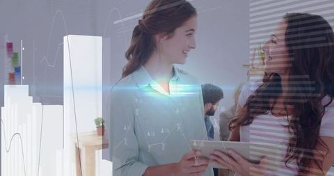 Strategic Collaboration Between Two Professional Women in Modern Office