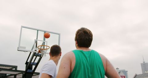 Two Male Basketball Players Practicing Outdoors