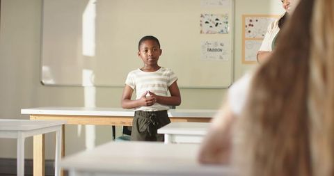 Young African American Girl Presenting to Class Showing Confidence and Public Speaking Skills