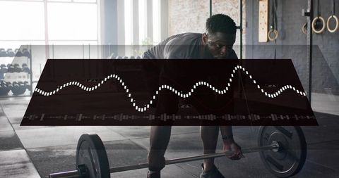 Athlete performing barbell deadlift with digital hud overlay in industrial gym
