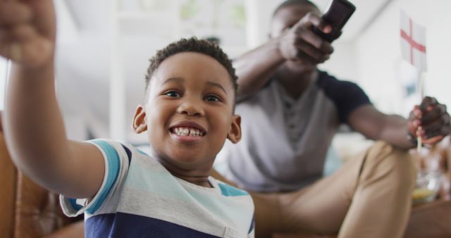 Excited Child and Parent Watching TV Together - Download Free Stock Images Pikwizard.com