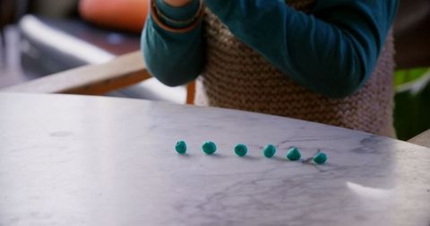 Boy enjoying creative play with colorful clay indoors