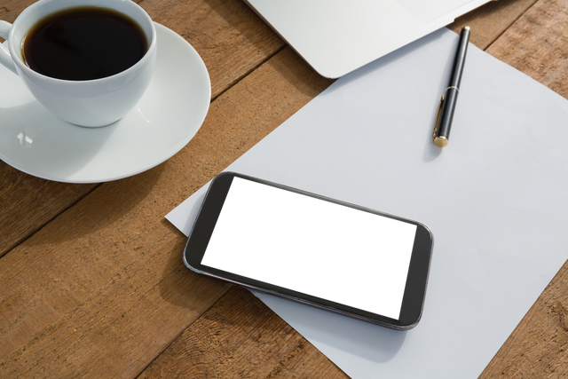 Transparent Mobile Phone, Coffee Cup, Paper, Pen on Wood Desktop - Download Free Stock Videos Pikwizard.com