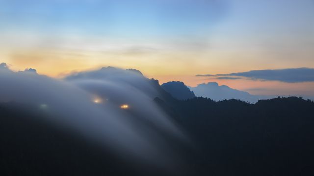 Misty Sunrise Over Mountain Range with Rolling Fog - Download Free Stock Photos Pikwizard.com