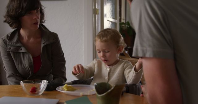 Young Child Eating with Family at Home - Download Free Stock Images Pikwizard.com