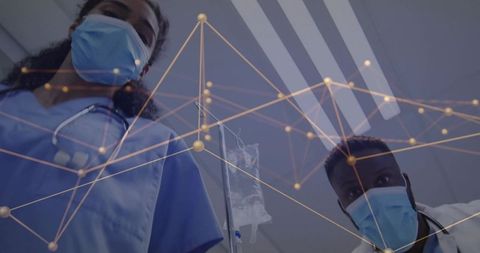 Medical team leaning over patient checking IV with network overlay for connected care