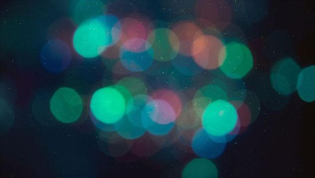 Vibrant abstract bokeh lights on dark background