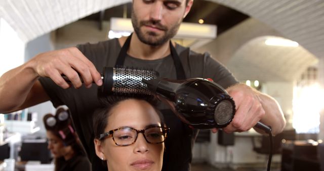 Professional Hairstylist Blow Drying Woman’s Hair in Salon - Download Free Stock Images Pikwizard.com