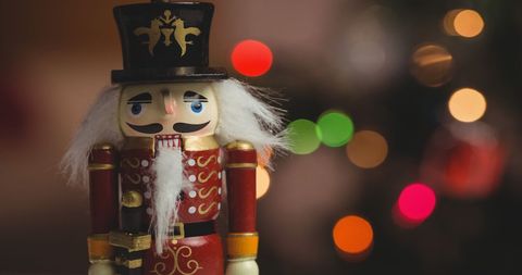 Traditional Wooden Nutcracker with Christmas Bokeh Lights