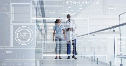 Walking physician and nurse reviewing tablet with hud data overlays in clinical corridor