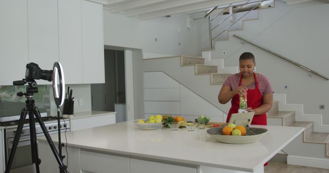 Content Creator Filming Cooking Video in Modern Kitchen - Download Free Stock Images Pikwizard.com