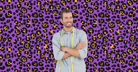 Caucasian fashion designer with seamless leopard print background