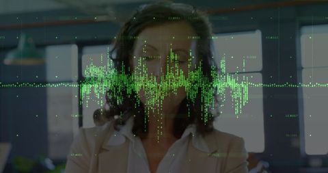Businesswoman Engaging with Futuristic Holographic Data in Modern Office