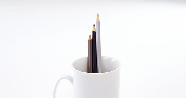 Colored Pencils in White Mug on Minimalist Background - Download Free Stock Images Pikwizard.com