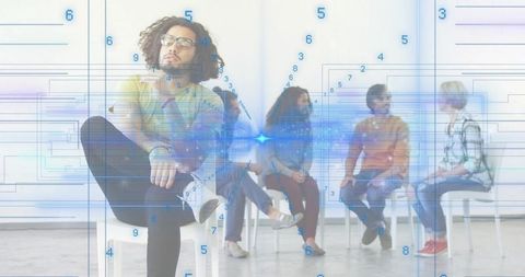 Creative team brainstorming with digital data overlay and blue light burst in studio meeting